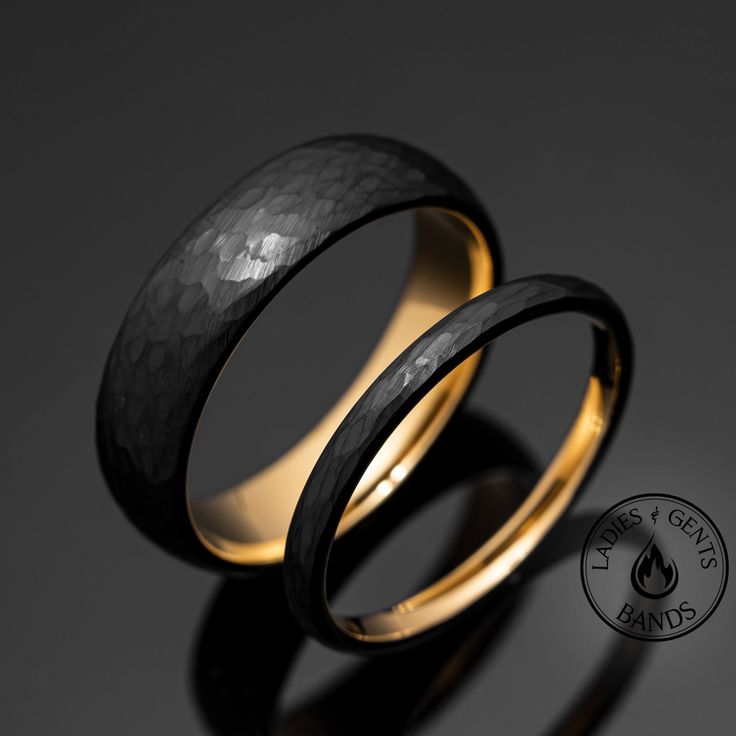 Your wedding ring set order includes + One 6mm Black Hammered Obsidian-styled tungsten Wedding Band with Gold Inlay + One 2mm Black Hammered Obsidian-styled tungsten Wedding Ring with Gold Inlay + Both Come inside Wax Sealed Ring Boxes. Limited Time: Free Matching Set of Black Silicone Bands w/ Order. *Durable - Incredibly Scratch-Resistant to always look great. *Comfort-fit & Weighty - Designed to fit well and feel good in your hand. *Made to order - Every ring we ship is unique and one-of-a-ki His And His Wedding Rings, Groom Ring Design, Wedding Bands His And Hers Unique, Wedding Ring Sets His And Hers, Wedding Rings For Men Unique, Black Wedding Bands For Men, Black Wedding Ring Sets, Black Wedding Bands, Wax Seal Ring