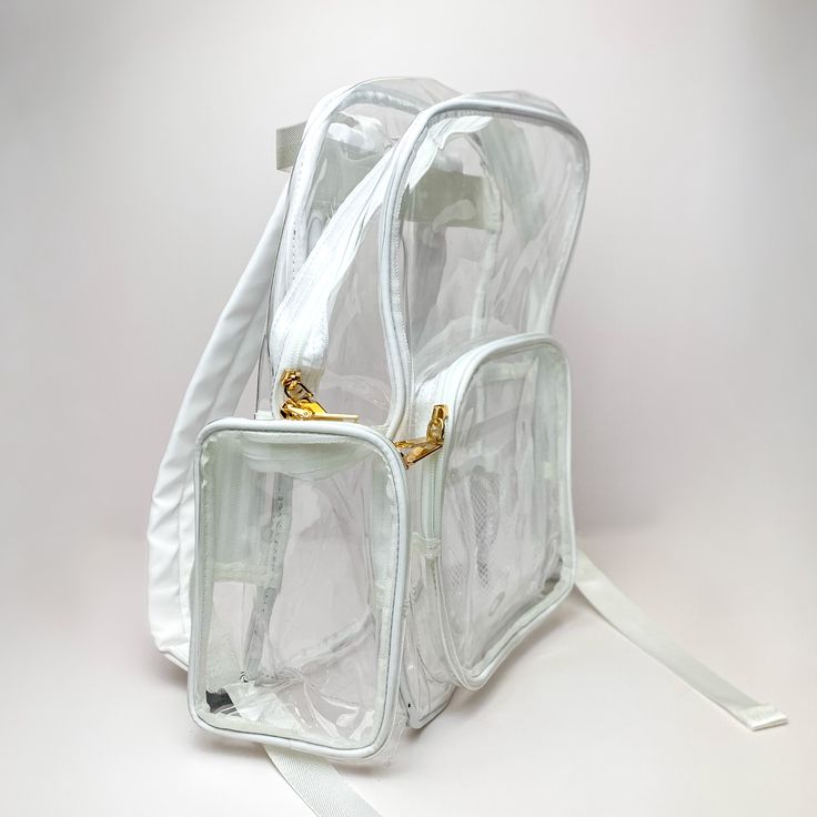 This backpack is perfect for any occasion! It includes an adjustable straps, front packet to put your phone for easy access, and two side pockets. This back pack measures 14 inches x 9.5 inches x 4.5 inches. SKU: #TG10437-CLWH White Bags With Clear Strap For On-the-go, White Softback Backpack For On-the-go, White Nylon Backpack For School, White Nylon School Backpack, Trendy White Nylon Backpack, White School Bag With Clear Strap, White Shoulder Bag With Zipper For Back To School, White Satchel Backpack With Zipper Closure, Trendy White Standard Backpack