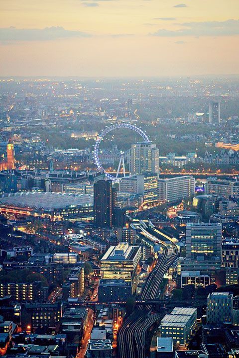 an aerial view of the london skyline at dusk