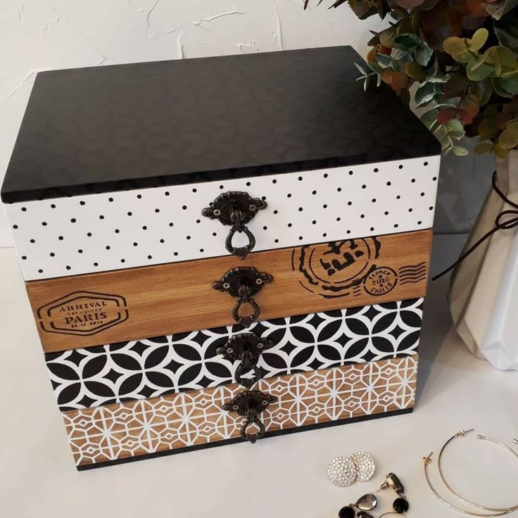 a wooden box sitting on top of a white table