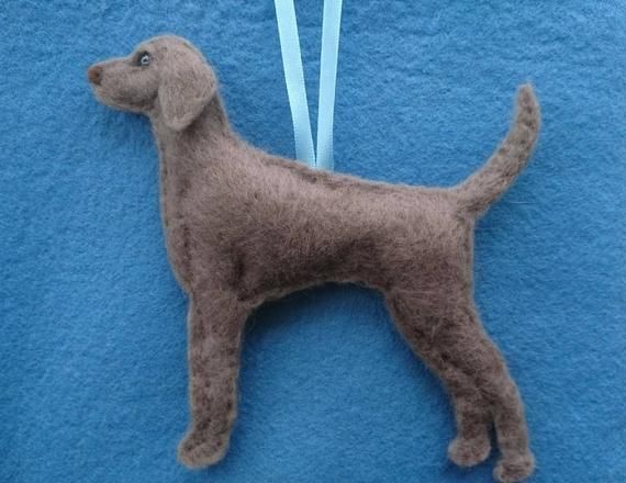 a brown dog ornament hanging on a blue towel