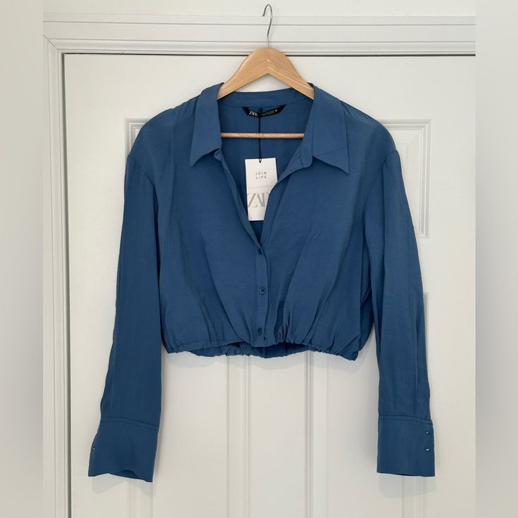 Zara Flowy Cropped Shirt In Blue. New With Tags. No Stains Or Tears, Never Worn. Size M. Cropped Blue Blouse For Work, Zara Blue Shirt For Day Out, Blue Cropped Blouse For Work, Casual Blue Zara Crop Top, Zara Blue Collared Top, Blue Zara Collared Top, Zara Blue Stretch Crop Top, Zara Blue Long Sleeve Blouse, Zara Trendy V-neck Crop Top