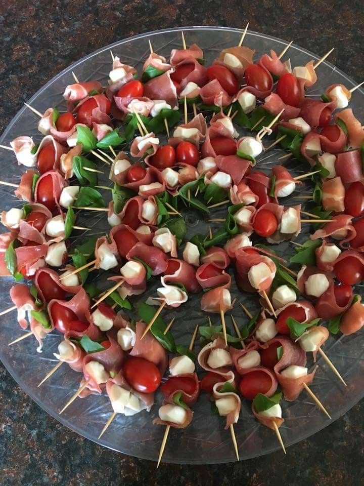 skewered meats and vegetables are arranged in a circle on a platter