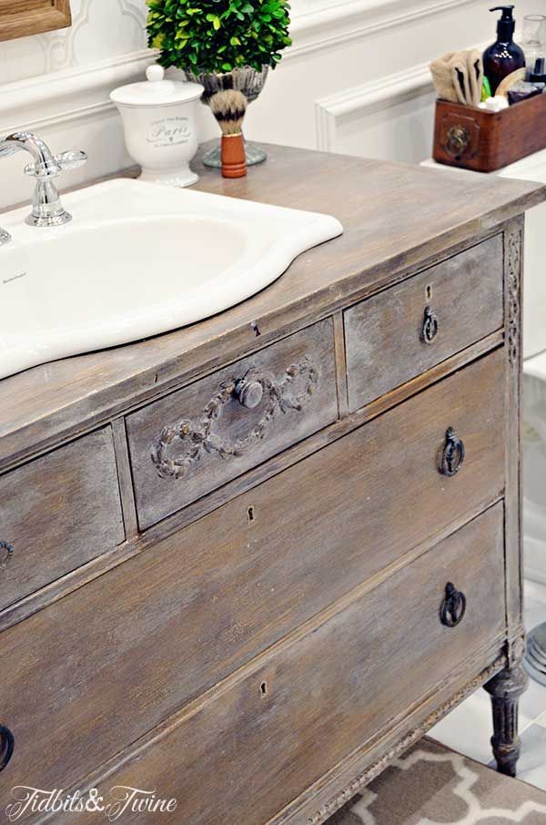 a bathroom with a sink, mirror and toilet in it's centerpieces