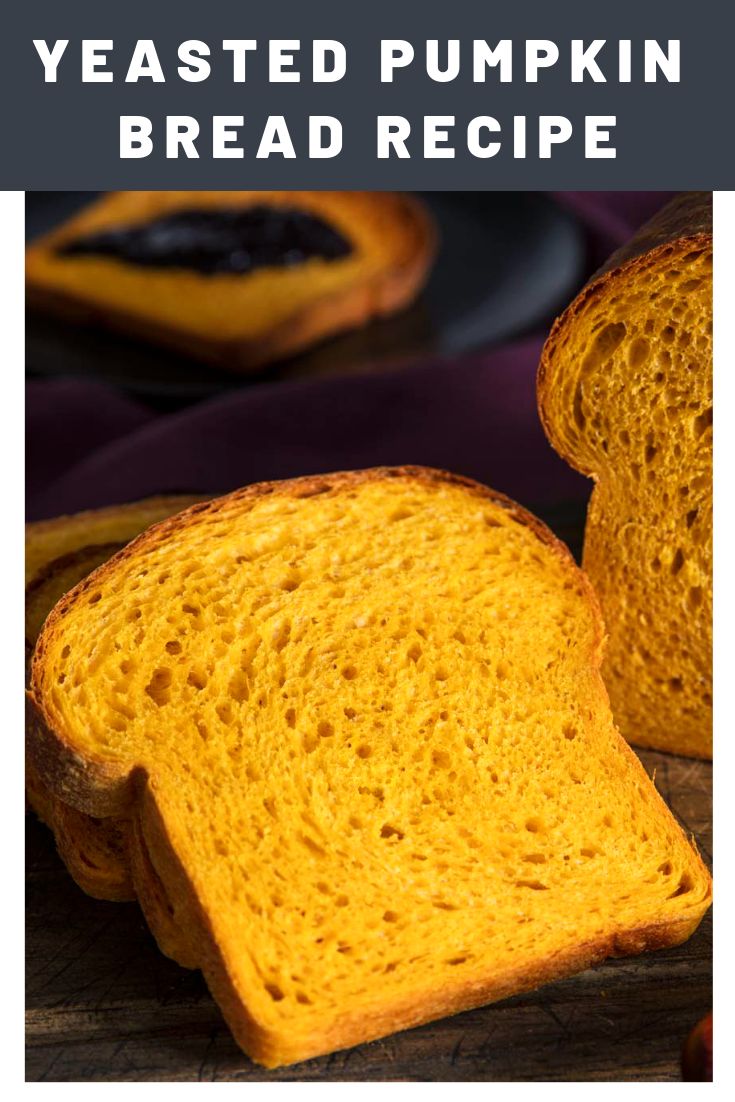 two slices of bread on a wooden cutting board