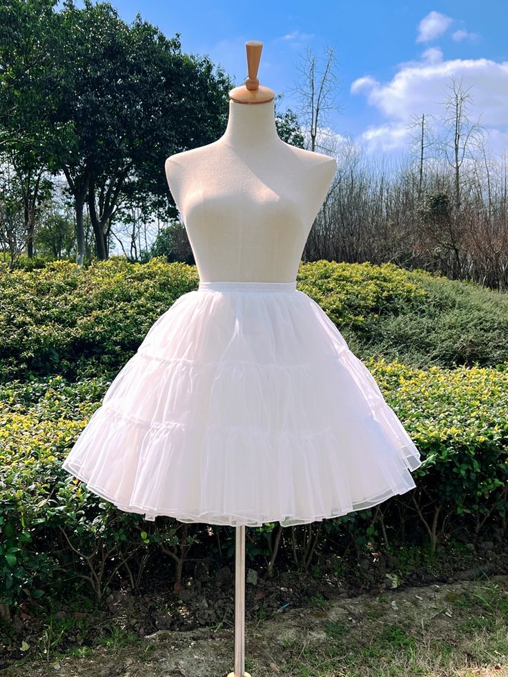 Enhance your Lolita or kawaii outfit with this stunning White 45cm Four Layers Organza Petticoat. The four layers of organza fabric create a beautiful, voluminous silhouette, perfect for adding extra flair to your look. The crisp white color makes it easy to pair with a variety of outfits, and the 45cm length provides just the right amount of lift. Elevate your style with this versatile and essential petticoat.   	 		 			Size 			Free Size 		 		 			Full Length 			45 		 		 			Waist 			58-80 Summer Crinoline Petticoat With Ruffles, Summer Balletcore Petticoat With Ruffles, Party Petticoat With Ruffles In Crinoline, Spring Wedding Petticoat With Ruffled Skirt, Spring Wedding Ruffled Petticoat, Spring Wedding Petticoat With Ruffles, Tulle Petticoat With Attached Cancan, Fitted Organza Petticoat With Ruffles, White Tiered Petticoat With Attached Cancan