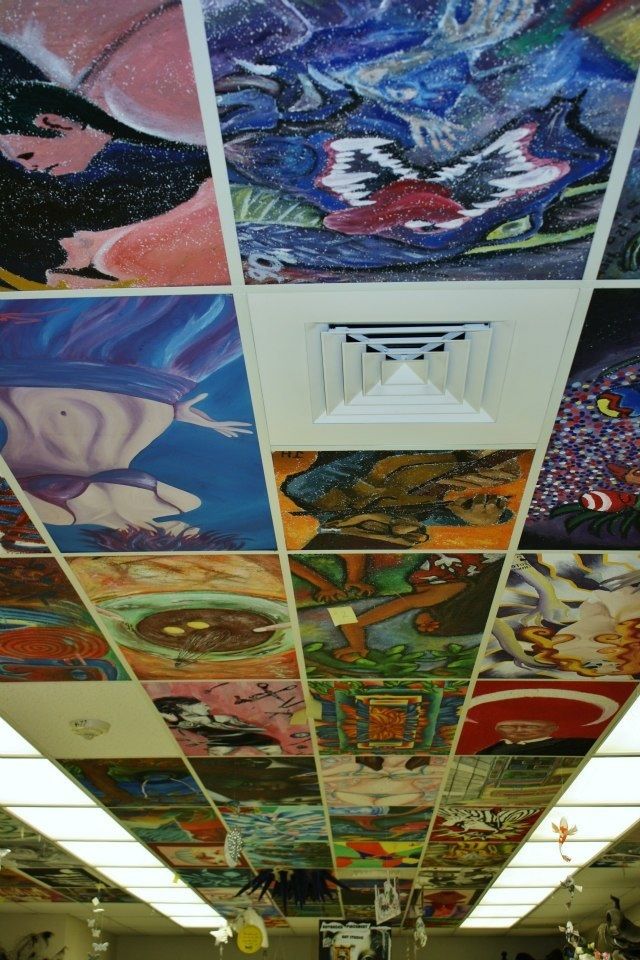 the ceiling is covered with many colorful paintings