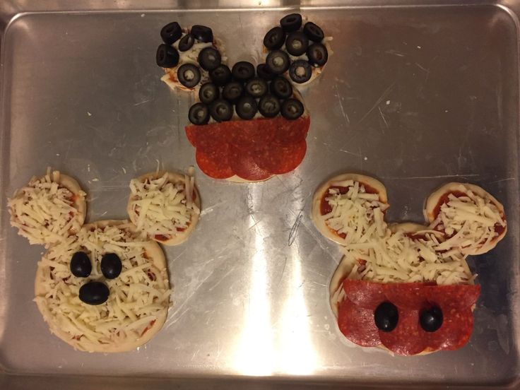 mickey mouse pizzas with cheese and black olives