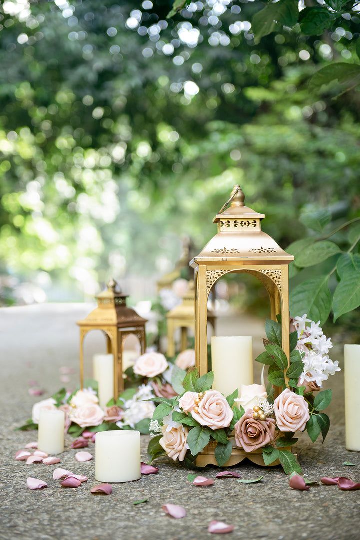 some candles and flowers on the ground