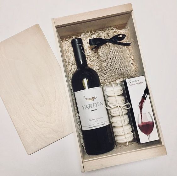 a bottle of wine and some crackers in a box