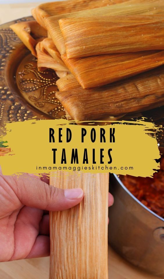 red pork tamales are being held by a hand