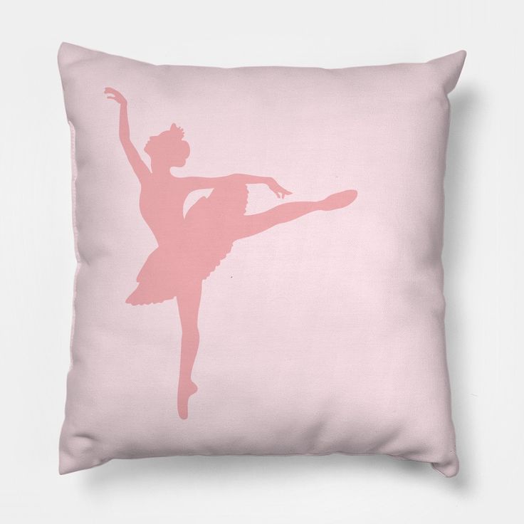 a pink pillow with a silhouette of a ballerina in the air, on a white background