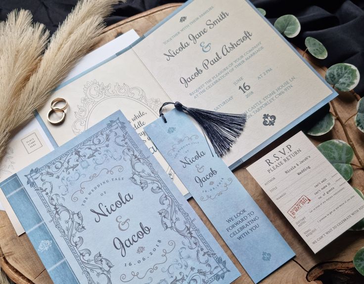 the wedding stationery is laid out on a table