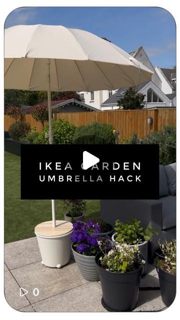 an umbrella and some potted plants in front of a house with the words ikea garden umbrella hack