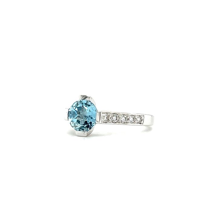 Elegantly made in 14K white gold, this modern aquamarine ring is perfect for both day and evening occasions. Its centerpiece, a marvelous 1.1ct round aquamarine, is bar set on four sides. The shank features 5 micro-prong diamonds on each side. With a polished to shine finish, all eyes will be on this exquisite aquamarine ring. 14K White Gold Aquamarine: 1- Round-shape with a total carat weight of 1.1ct Diamond: 10- Round-cut with a total carat weight of 0.28ct Polished Finish Finger Size: 7 Light Blue Diamond Rings With Prong Setting, White Gold Aquamarine Rings With Brilliant Cut, White Gold Brilliant Cut Aquamarine Rings, Classic Light Blue Diamond Ring, Aquamarine Round Cut Diamond Ring In White Gold, White Gold Aquamarine Round Cut Diamond Ring, Aquamarine Diamond Ring In White Gold, Light Blue Diamond Ring With Brilliant Cut, White Gold Aquamarine Diamond Ring, Round Cut