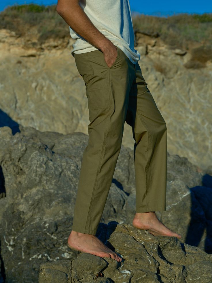 Because you are the ultimate man we designed the ultimate pants. They have everything you need to reach new heights: an elastic waistband with a hidden drawcord, pockets aplenty, a gusset in the crotch for a perfect fit, and slightly tapered legs. Easy! 100% Cotton Manufactured at a socially and environmentally responsible factory Relaxed Fit Full Length Cargo Pants For Everyday, Everyday Relaxed Fit Full Length Cargo Pants, Outdoor Tapered Leg Pants With Hip Pockets, Relaxed Fit Outdoor Trousers, Relaxed Fit Trousers For Outdoor, Loosely Fitted Hip Pocket Work Pants With Tapered Leg, Loosely Fitted Parachute Pants With Hip Pockets, Relaxed Fit Trousers With Side Pockets, Everyday Trousers With Side Pockets