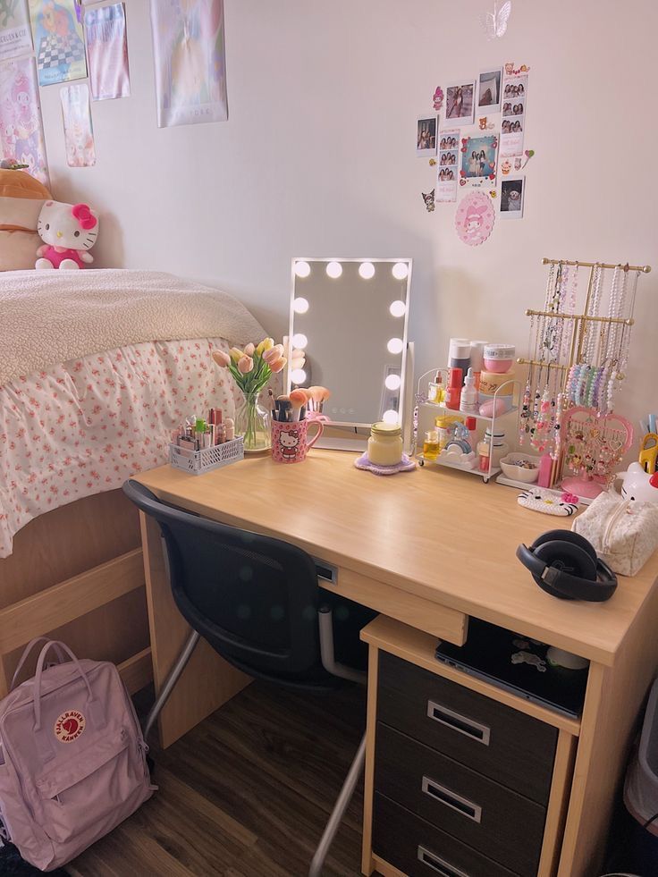 a bedroom with a desk, mirror and other items on the table in front of it