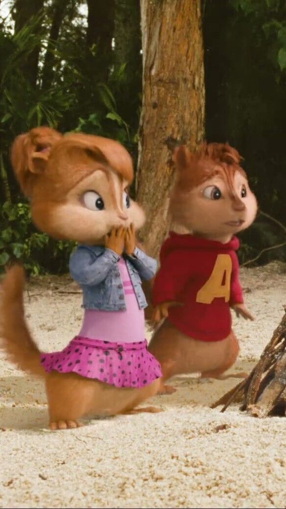 two chipmuns are standing next to each other in the sand near a tree