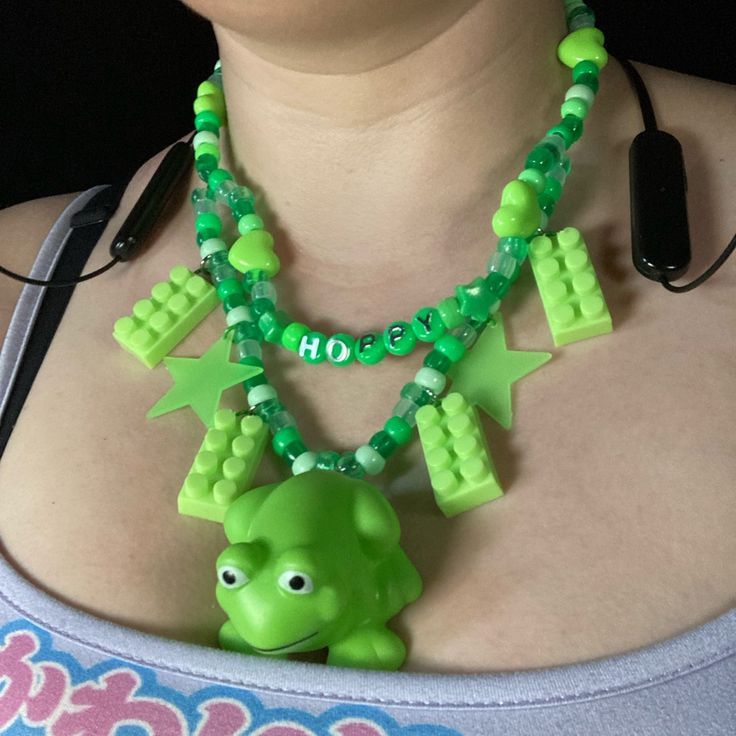 Feeling Hoppy? Or Maybe You Just Love Frogs? This Necklace Is For You! Features Squishy Frog Toy, Legos, And Glow In The Dark Stars. Length Is 19.5 Inches, But Can Be Made Longer. Playful Green Plastic Jewelry, Green Fun Plastic Jewelry, Fun Green Plastic Jewelry, Fun Green Necklaces For Gifts, Fun Green Necklaces For Gift, Playful Green Necklaces For Gift, Fun Green Necklace For Gift, Playful Green Necklace For Gifts, Handmade Green Novelty Necklace