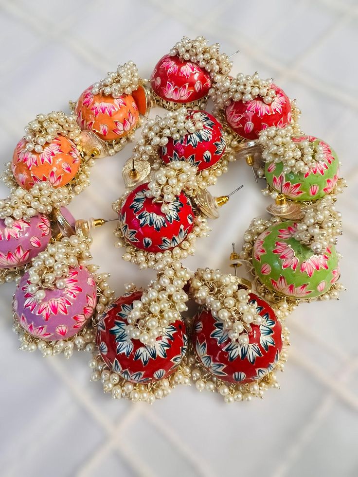 a bunch of ornaments sitting on top of a white tile floor next to each other