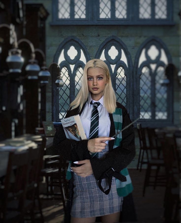 a woman in a school uniform holding a book