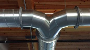 an image of a metal pipe in the ceiling