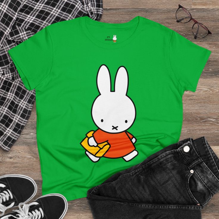 Get ready for back to school season with this adorable Miffy back to school tee! Made from soft and breathable fabric, this charming graphic tee features a cute and cheerful Miffy design that is perfect for your first day back in the classroom. Whether it's for wearing to school or just for everyday wear, this tee is sure to become a favorite in your wardrobe. Add a touch of fun and whimsy to your back to school wardrobe with this delightful Miffy tee! What's better than a soft, light cotton, quality t-shirt in your wardrobe? This comfy, contoured 100% cotton tee offers a semi-fitted silhouette and is pre-shrunk to ensure it stays a staple for longer. It features cap sleeves and a taped neck and shoulders. Miffy print on chest and back. 100% cotton  Medium fabric (5.3 oz/yd² (180 g/m Semi- Playful Funny Print T-shirt For School, Playful T-shirt For Back To School, Casual Cotton T-shirt With Cute Design, Playful Cotton T-shirt With Cute Design, Fun Green T-shirt For School, Playful Crew Neck T-shirt With Cute Design, Playful Green Tops For School, Playful Green Top For School, Back To School Cotton T-shirt