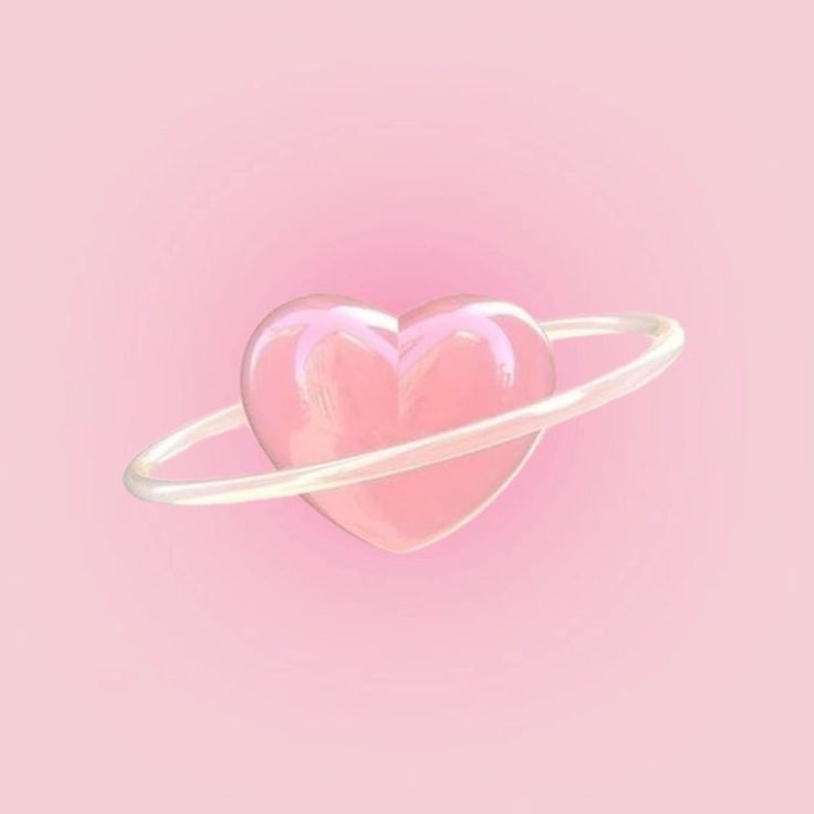 a pink heart in the center of a white ring on a pink background with space around it