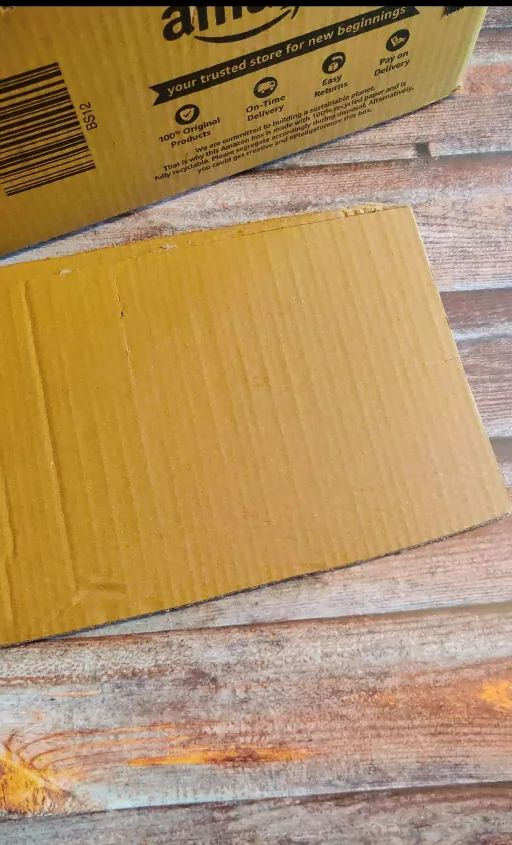 an amazon box sitting on top of a wooden table