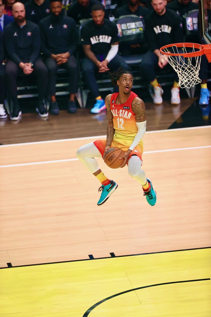 a basketball player jumping up into the air