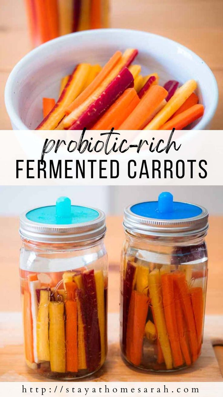 two jars filled with pickled carrots on top of a wooden table next to each other