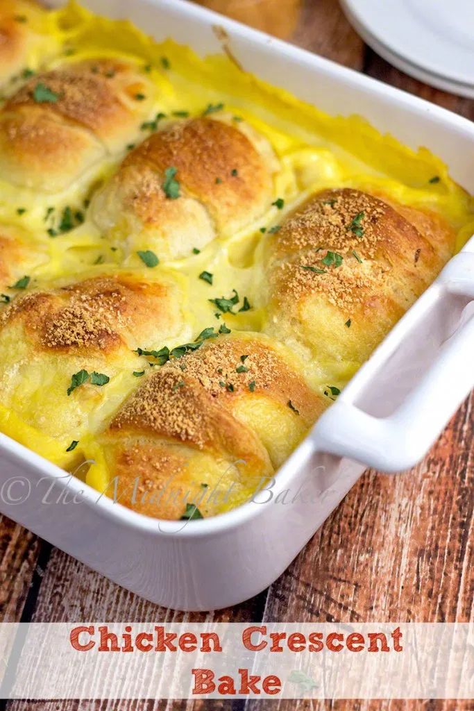 chicken crescent bake in a white casserole dish with parsley on top