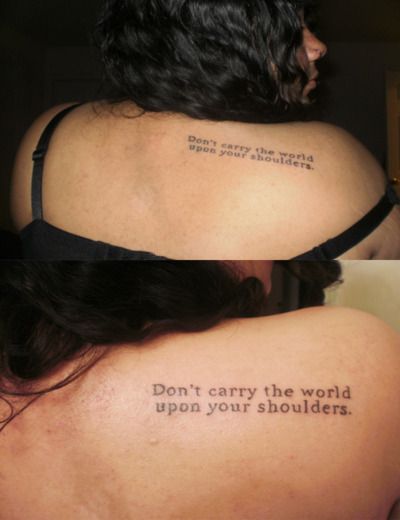 the back of a woman's shoulder with an inscription on it that says don't carry the world upon your shoulders