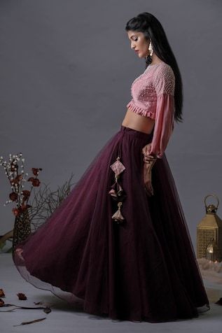 Purple lehenga in a solid base with tasselled side tie. Comes with pink frilled hem blouse embellished by pearls. - Aza Fashions Anarkali Designer Lehenga With Tassels, Designer Choli With Tassels For Festivals, Designer Festive Choli With Tassels, Designer Festival Choli With Tassels, Festive Pink Sharara With Tassels, Festive Pink Tassel Sharara, Festive Sharara With Tassels For Reception, Traditional Pink Sets With Tassels, Festive Fitted Choli With Tassels