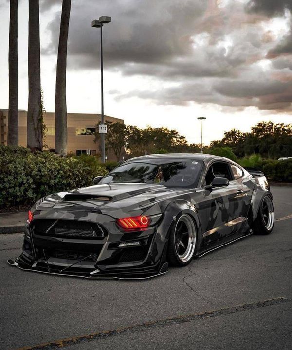 a black sports car parked on the street