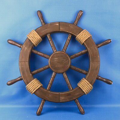 a wooden ship steering wheel on a blue background