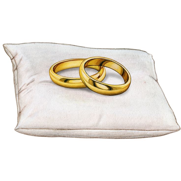 two gold wedding rings on a white pillow