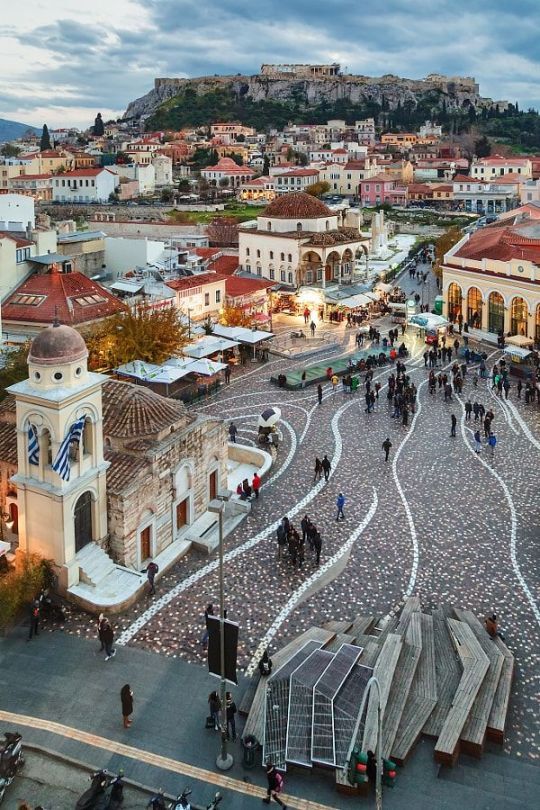 an aerial view of a city with people walking around