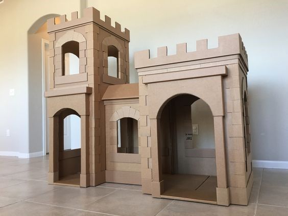 two cardboard castles sitting on top of each other