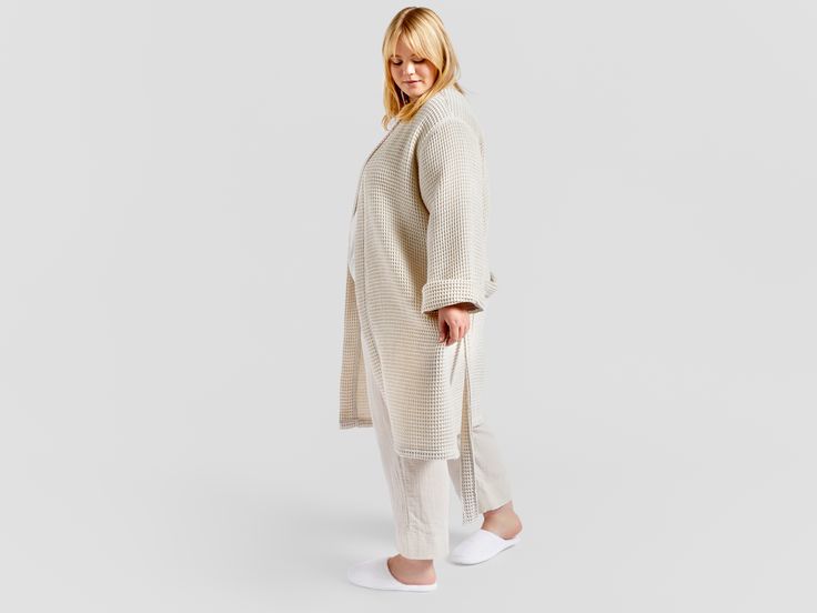 Relax in this lightweight, softly textured bathrobe inspired by the world's finest spas. Features two hip pockets, a folded collar and secure waist tie. Waist Tie, Collar