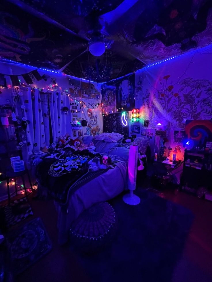 a bedroom with purple lighting and decorations on the walls