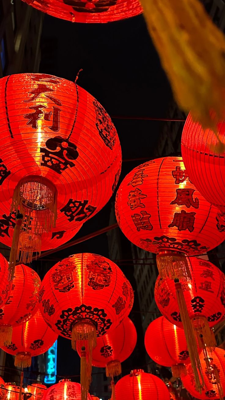 many red lanterns are hanging in the air