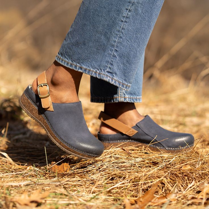 We used our patented stapled construction to add high-quality leathers to a midsole made with sustainable and durable cork in Merrin. A heel strap on this thoughtfully crafted mule provides a lighter take on support, and leathers produced with waste-reducing methods will give you a wardrobe staple you can feel good about. Leather Clogs With Cork-bed Midsoles, Leather Mules With Cork-bed Midsoles And Open Heel, Dansko Clogs Outfit, Teacher Shoes, Smartwool Socks, Suede Shoes Women, Mary Jane Clogs, Clog Boots, Vision Boards