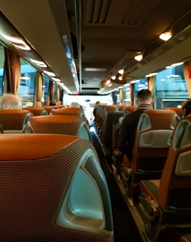 an empty bus with people sitting in it