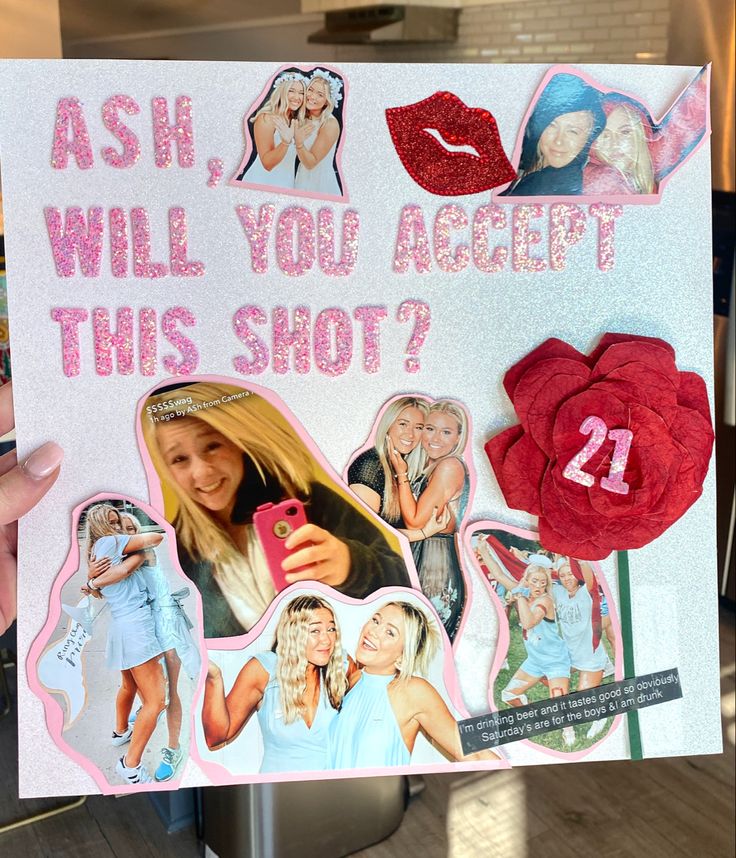 a woman holding up a sign with pictures on it that says, ash, will you accept this shot?