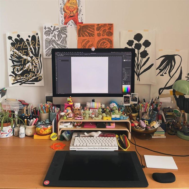 a desktop computer sitting on top of a wooden desk