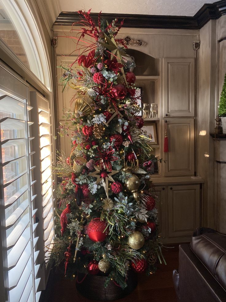 a decorated christmas tree in a living room