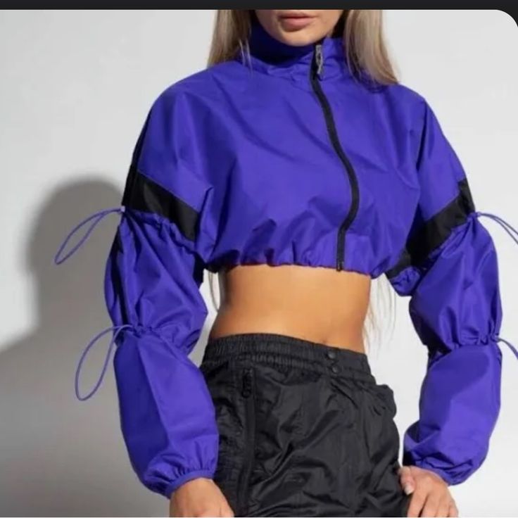 Reebok X Cardi B Woven Crop Jacket Purple Sports Outerwear For Fall, Purple Sporty Track Jacket For Spring, Sporty Purple Track Jacket For Spring, Sporty Purple Track Jacket For Fall, Casual Purple Track Jacket For Fall, Purple Sports Outerwear For Spring, Purple Casual Track Jacket For Fall, Purple Athleisure Outerwear For Outdoor, Purple Outerwear For Sports In Spring