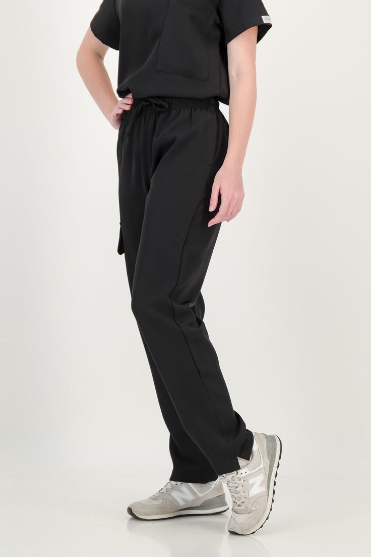 Bringing comfort and elegance to your workspace with our Jogger or Straight Fit scrub pants for Women. How does it fit High waisted for the feminine figure. Scrubbies signature waistband, adjustable and elasticated. Cargo pocket Flexi fabric that is soft, with a mild stretch, for ease of movement. Tapered cut with slits on the ankles. Model is wearing size XS: height 5’4 (164cm), waist 25, weight 110lbs (50kg) Medical Scrubs Outfit, Fit Scrubs, Scrubs Outfit, Black Scrubs, Nursing Student, Scrub Sets, Medical Scrubs, Cargo Pocket, Joggers Womens