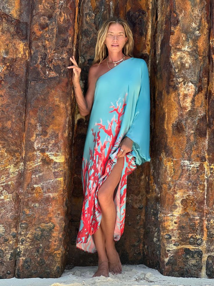 RENEE KAFTAN CORAL REEF The Renee Kaftan is one shoulder flowy, yet sexy silhouette that is so versatile it can be worn for no occasion except to feel beautiful to an occasion like a wedding. This dress is a stunner! It has a relaxed silhouette with a voluminous kaftan-style sleeve. One shoulder Asymmetric hemline 100% Dull Satin Dry clean or Hand Wash/Hang Dry The print is an original Ramona La Rue hand painted by the designer and transferred to fabric. Every garment has Arianne’s signature in Kaftan Style, Black And White Flowers, Feel Beautiful, Mini Dress Casual, Kaftan Dress, Coral Reef, How To Feel Beautiful, A Wedding, Print Dress